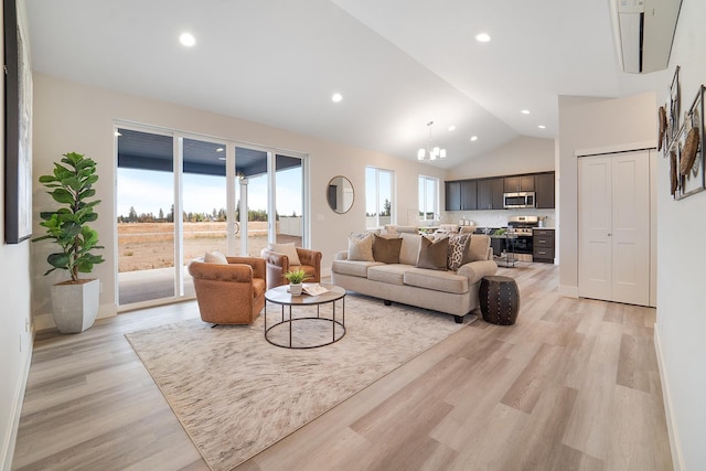 5763 S Sherri Lea Rd, Spokane, WA 99224 - living area featuring lofted ceiling, light wood-style flooring, a chandelier, recessed lighting, and baseboards