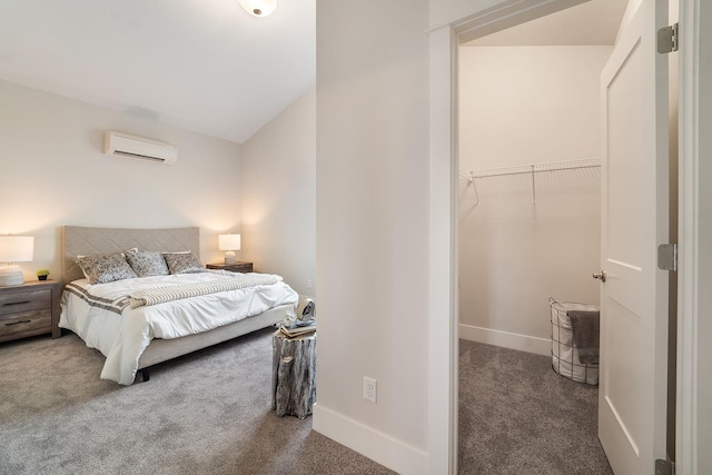 5763 S Sherri Lea Rd, Spokane, WA 99224 - bedroom with an AC wall unit, carpet floors, baseboards, a spacious closet, and vaulted ceiling
