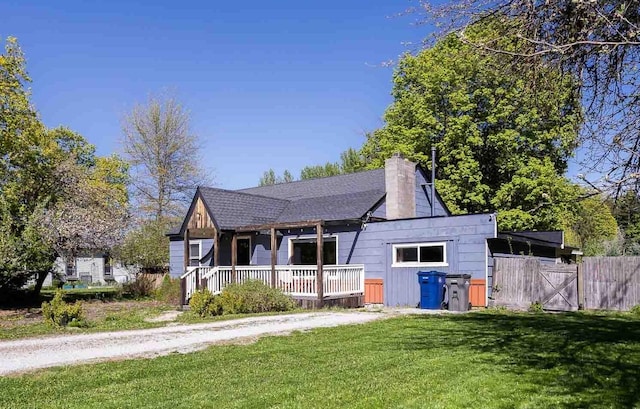 211 4th St, Dover, ID 83825 - view of front of house featuring a chimney