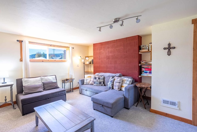 211 4th St, Dover, ID 83825 - living area featuring light carpet and baseboards