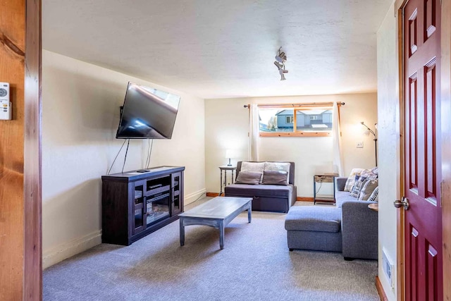 211 4th St, Dover, ID 83825 - carpeted living area featuring baseboards