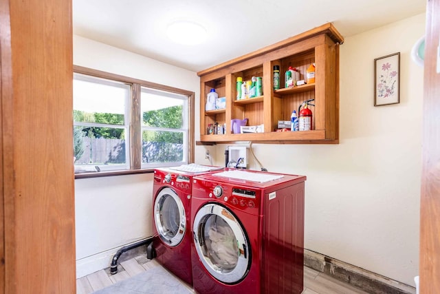 211 4th St, Dover, ID 83825 - laundry area with separate washer and dryer and baseboards