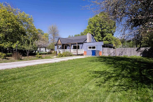 211 4th St, Dover, ID 83825 - view of front of home featuring a chimney