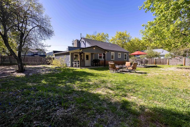 211 4th St, Dover, ID 83825 - rear view of house featuring a patio area