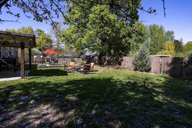211 4th St, Dover, ID 83825 - view of yard featuring a patio and an outdoor fire pit