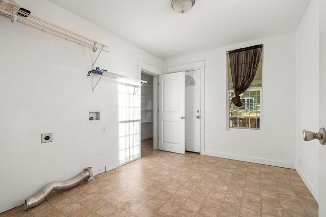 217 S Broadway St, Tekoa, WA 99033 - laundry room with hookup for an electric dryer, hookup for a washing machine, and baseboards