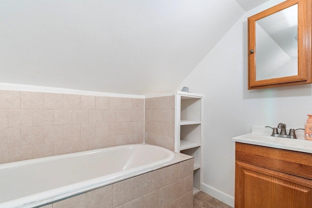 217 S Broadway St, Tekoa, WA 99033 - full bath with lofted ceiling, vanity, a garden tub, and baseboards