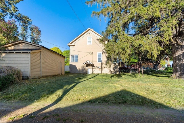 217 S Broadway St, Tekoa, WA 99033 - rear view of property featuring a lawn