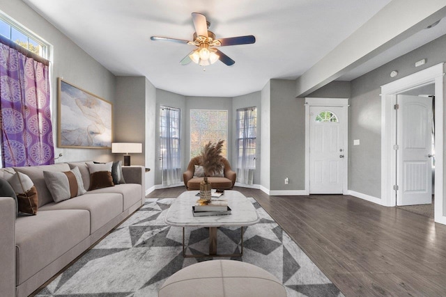 217 S Broadway St, Tekoa, WA 99033 - living room with a ceiling fan, healthy amount of natural light, wood finished floors, and baseboards