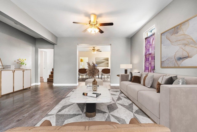 217 S Broadway St, Tekoa, WA 99033 - living room featuring ceiling fan, wood finished floors, stairway, and baseboards