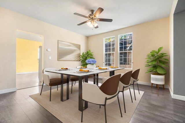 217 S Broadway St, Tekoa, WA 99033 - dining area featuring wood finished floors, baseboards, and ceiling fan
