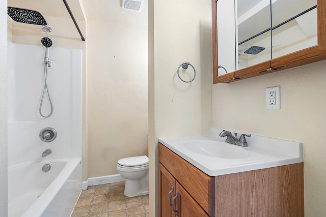 217 S Broadway St, Tekoa, WA 99033 - bathroom featuring toilet, vanity, shower / bath combination, baseboards, and stone finish floors