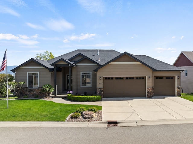 8504 E Black Oak Ln, Spokane, WA 99217 - craftsman house with a garage, stone siding, concrete driveway, and a front lawn
