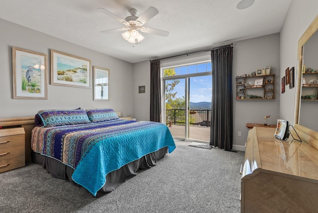 8504 E Black Oak Ln, Spokane, WA 99217 - bedroom featuring carpet floors, access to exterior, multiple windows, and ceiling fan
