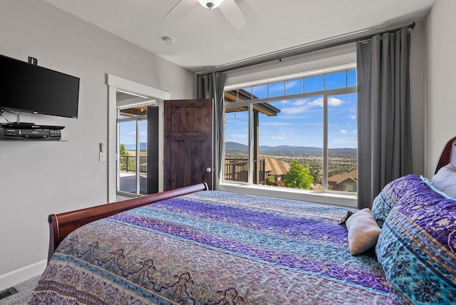 8504 E Black Oak Ln, Spokane, WA 99217 - carpeted bedroom with access to outside, baseboards, and a ceiling fan
