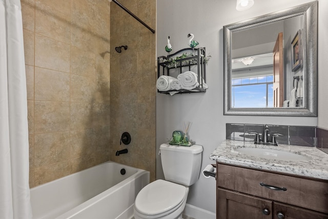 8504 E Black Oak Ln, Spokane, WA 99217 - bathroom featuring shower / bath combination with curtain, toilet, vanity, and baseboards