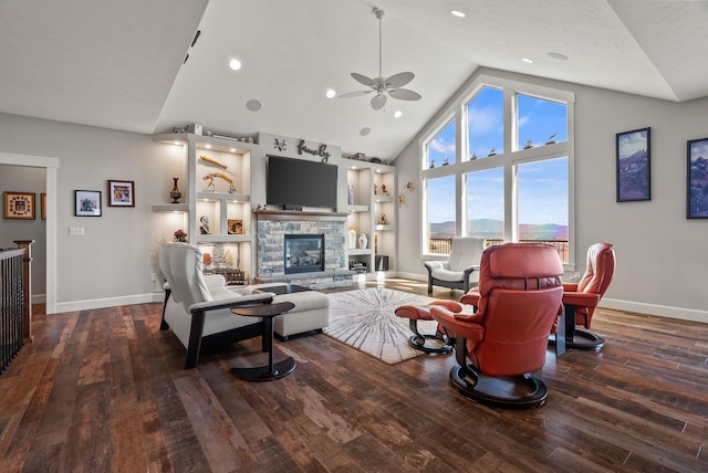 8504 E Black Oak Ln, Spokane, WA 99217 - living room featuring ceiling fan, baseboards, a fireplace, hardwood / wood-style floors, and high vaulted ceiling