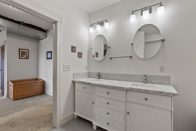 8504 E Black Oak Ln, Spokane, WA 99217 - bathroom with double vanity and baseboards