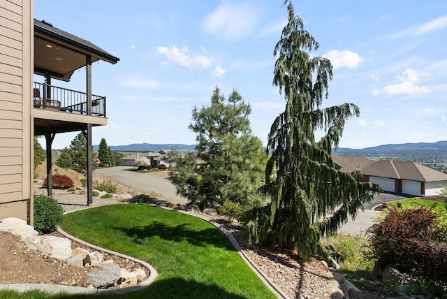 8504 E Black Oak Ln, Spokane, WA 99217 - view of grassy yard with a mountain view and a balcony