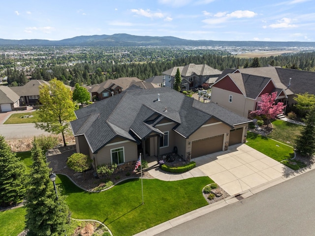 8504 E Black Oak Ln, Spokane, WA 99217 - aerial perspective of suburban area with a mountain backdrop