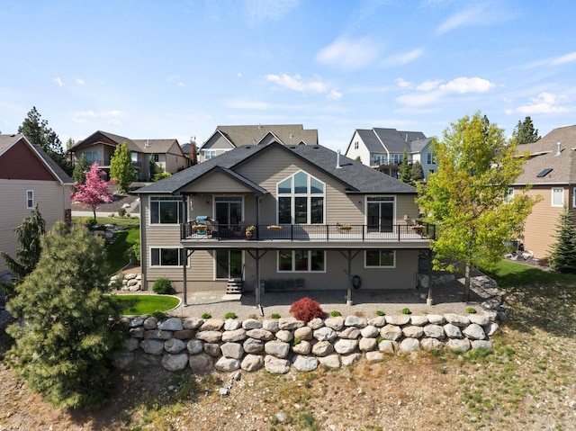 8504 E Black Oak Ln, Spokane, WA 99217 - back of property featuring a patio area, a residential view, and a deck