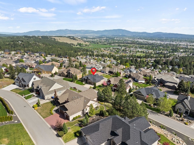 8504 E Black Oak Ln, Spokane, WA 99217 - aerial view of property's location with a mountainous background and nearby suburban area