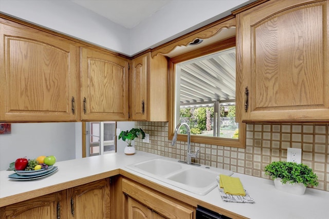 13519 E 26th Ave, Spokane, WA 99216 - kitchen featuring a sink, light countertops, and decorative backsplash