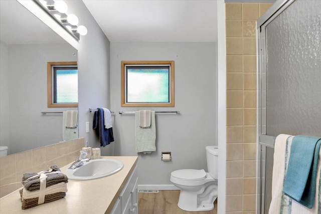 13519 E 26th Ave, Spokane, WA 99216 - bathroom with toilet, a shower stall, and vanity