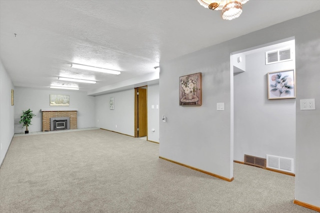 13519 E 26th Ave, Spokane, WA 99216 - unfurnished living room with carpet flooring, baseboards, and a brick fireplace