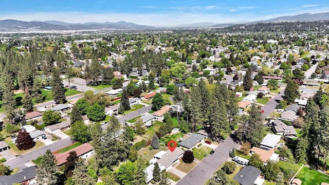 13519 E 26th Ave, Spokane, WA 99216 - aerial overview of property's location featuring mountains and nearby suburban area