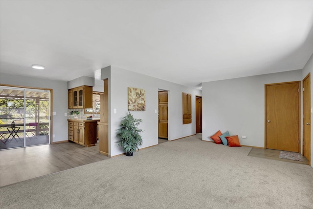 13519 E 26th Ave, Spokane, WA 99216 - unfurnished living room featuring light colored carpet and baseboards