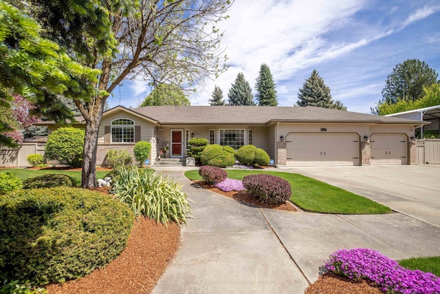 5123 E Lane Park Ct, Mead, WA 99021 - ranch-style house featuring brick siding, an attached garage, driveway, and fence