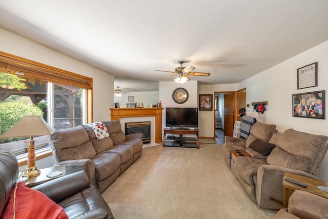 5123 E Lane Park Ct, Mead, WA 99021 - living area featuring a tiled fireplace, light colored carpet, and a ceiling fan