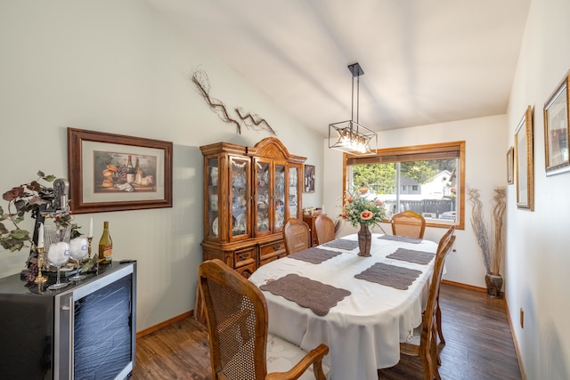 5123 E Lane Park Ct, Mead, WA 99021 - dining area featuring wine cooler, wood finished floors, baseboards, a chandelier, and lofted ceiling