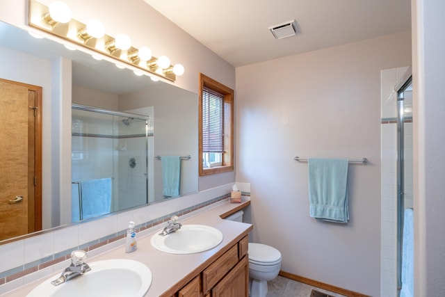 5123 E Lane Park Ct, Mead, WA 99021 - bathroom featuring a shower stall, double vanity, and toilet