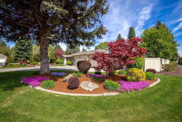 5123 E Lane Park Ct, Mead, WA 99021 - view of green lawn featuring driveway and an attached garage