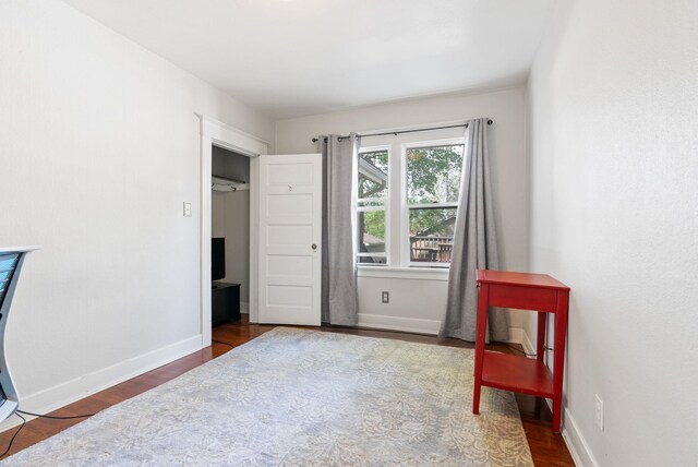 sitting room featuring wood finished floors and baseboards
