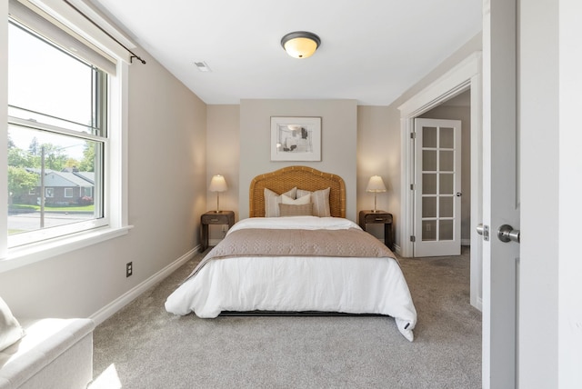 carpeted bedroom featuring baseboards
