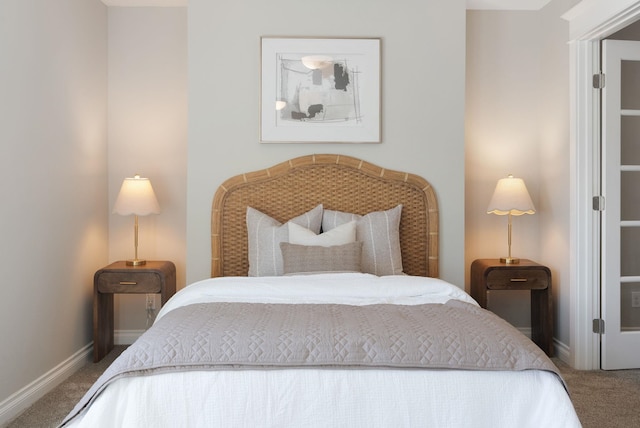 carpeted bedroom with baseboards