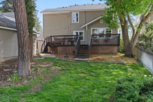 back of house featuring a wooden deck and stairway