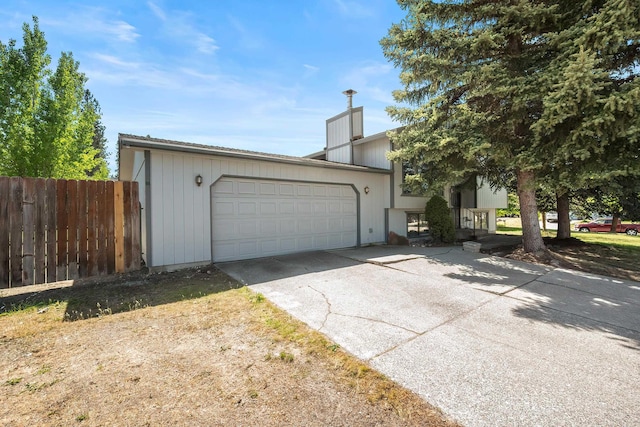 3326 E Pineglen Ave, Mead, WA 99021 - view of front facade with fence, a garage, a chimney, and driveway