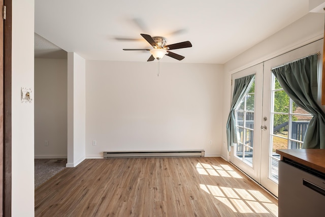 3326 E Pineglen Ave, Mead, WA 99021 - unfurnished room featuring light wood-style flooring, baseboards, french doors, baseboard heating, and a ceiling fan