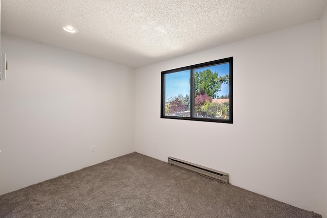 3326 E Pineglen Ave, Mead, WA 99021 - carpeted empty room featuring a baseboard radiator, a textured ceiling, and recessed lighting
