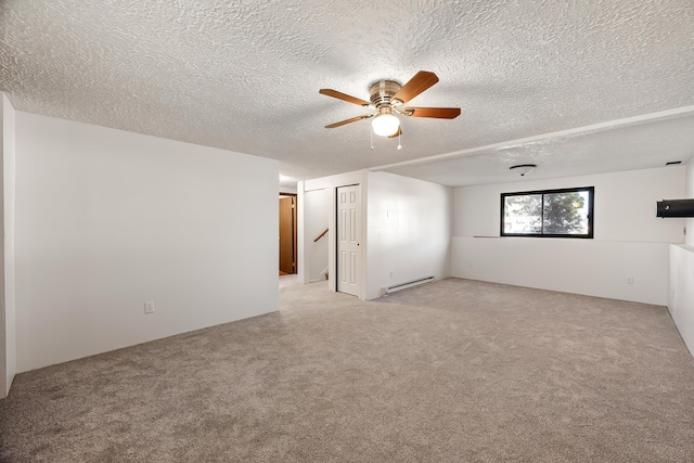 3326 E Pineglen Ave, Mead, WA 99021 - unfurnished room featuring a baseboard heating unit, light colored carpet, a textured ceiling, and a ceiling fan