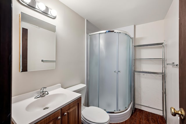 3326 E Pineglen Ave, Mead, WA 99021 - full bath featuring a shower stall, wood finished floors, vanity, and toilet