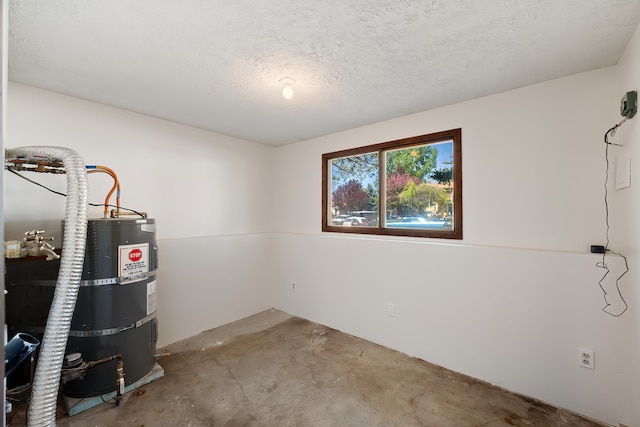 3326 E Pineglen Ave, Mead, WA 99021 - below grade area featuring secured water heater and a textured ceiling