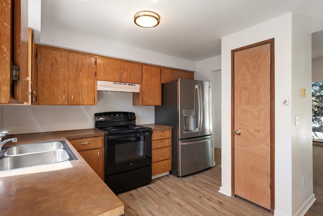 3326 E Pineglen Ave, Mead, WA 99021 - kitchen with black / electric stove, a sink, stainless steel fridge with ice dispenser, under cabinet range hood, and light wood finished floors