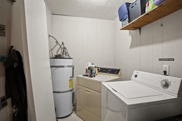 420 E Sanson Ave, Spokane, WA 99207 - laundry room with secured water heater, washer and dryer, and wood walls
