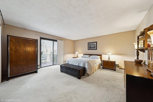 10511 E Cimmaron Dr, Spokane, WA 99206 - bedroom with access to outside, light carpet, a textured ceiling, and a baseboard radiator