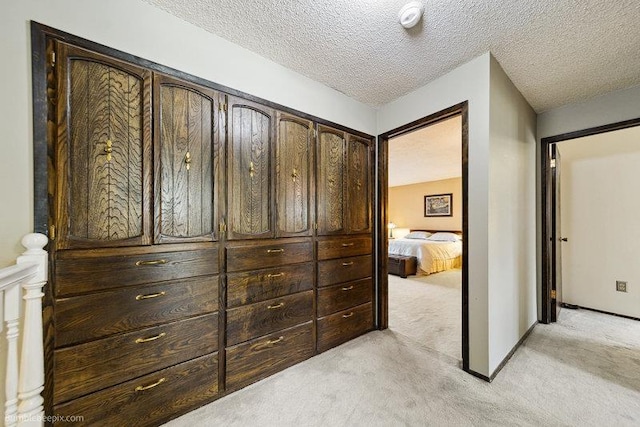 10511 E Cimmaron Dr, Spokane, WA 99206 - hallway featuring light carpet and a textured ceiling